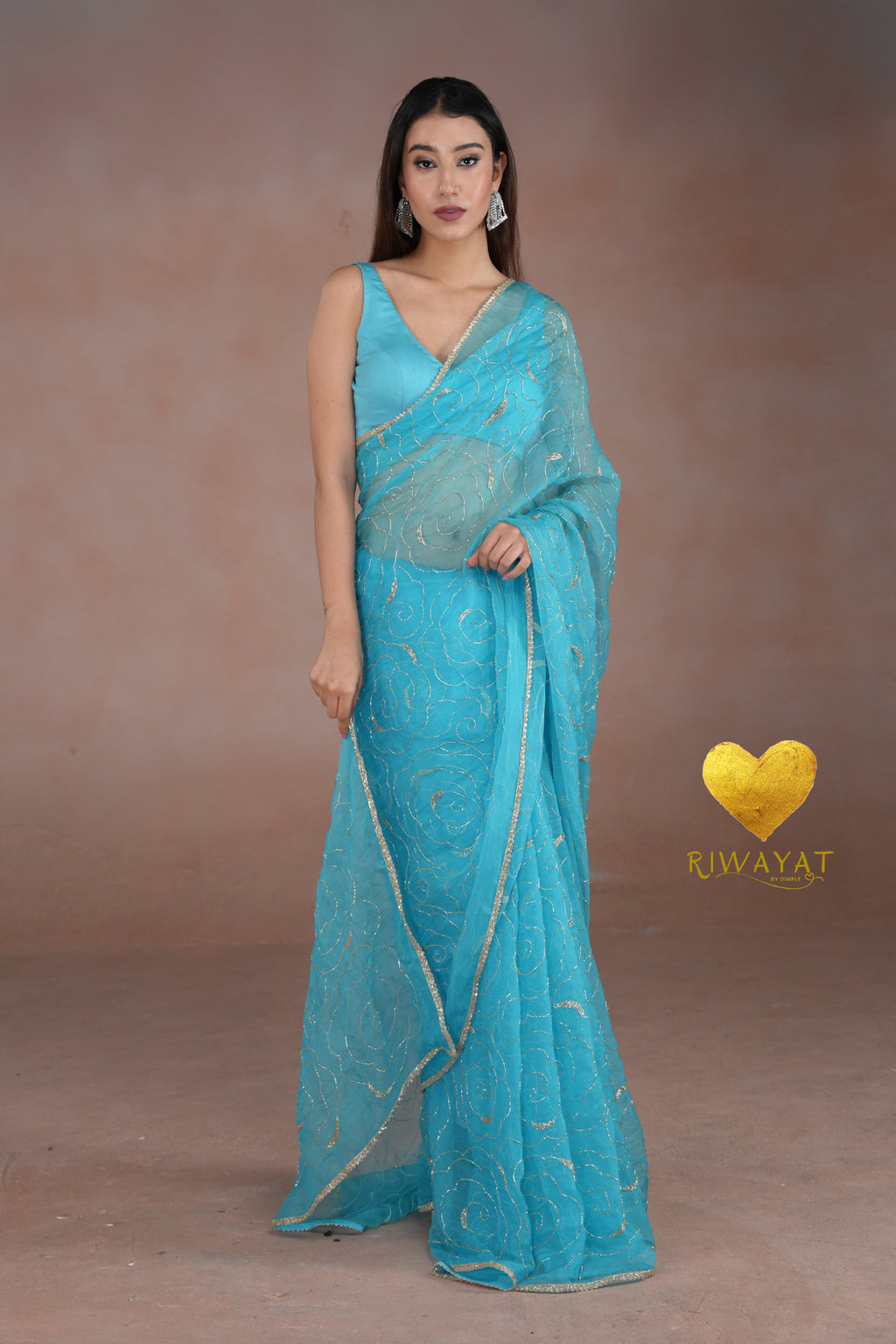 Turquoise Blue Organza Saree with Floral Swirl Embroidery