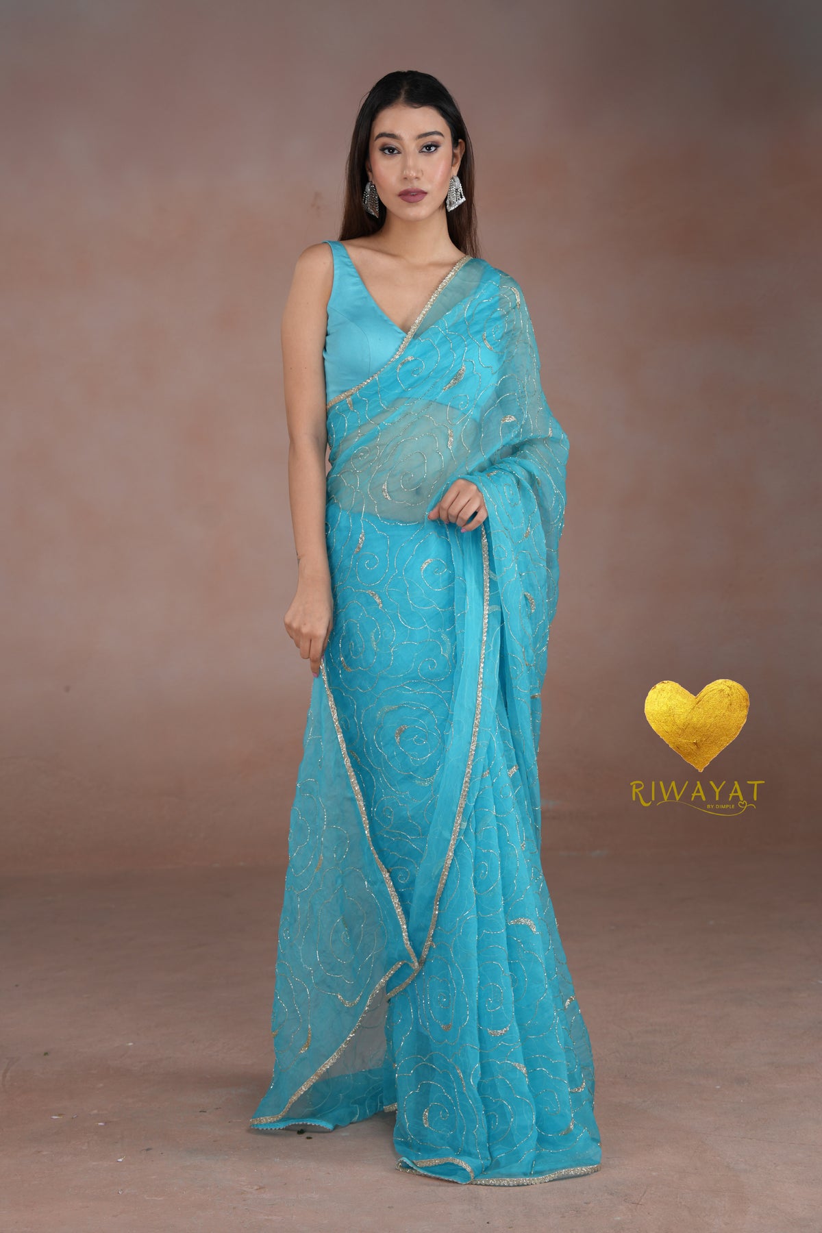 Turquoise Blue Organza Saree with Floral Swirl Embroidery