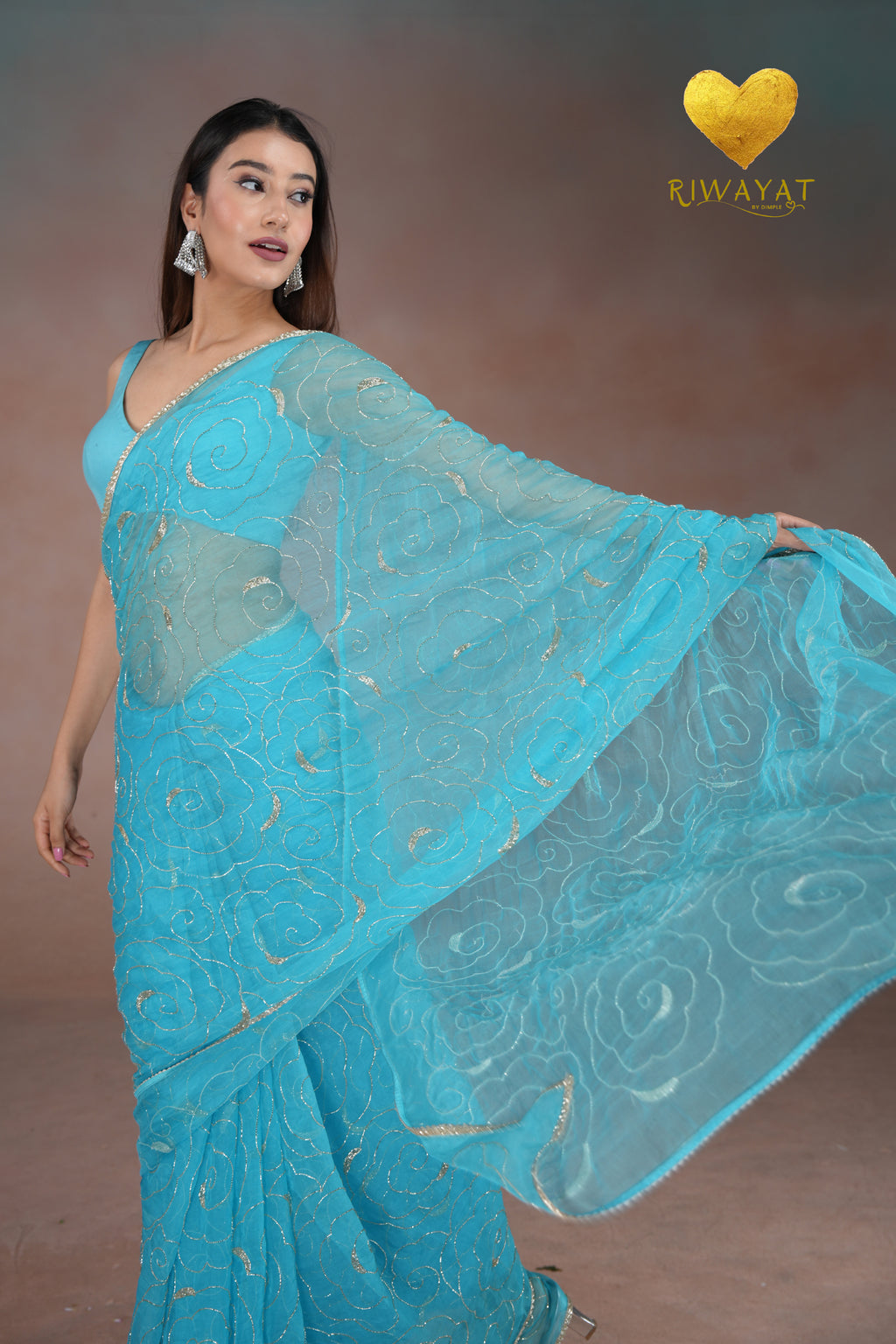 Turquoise Blue Organza Saree with Floral Swirl Embroidery