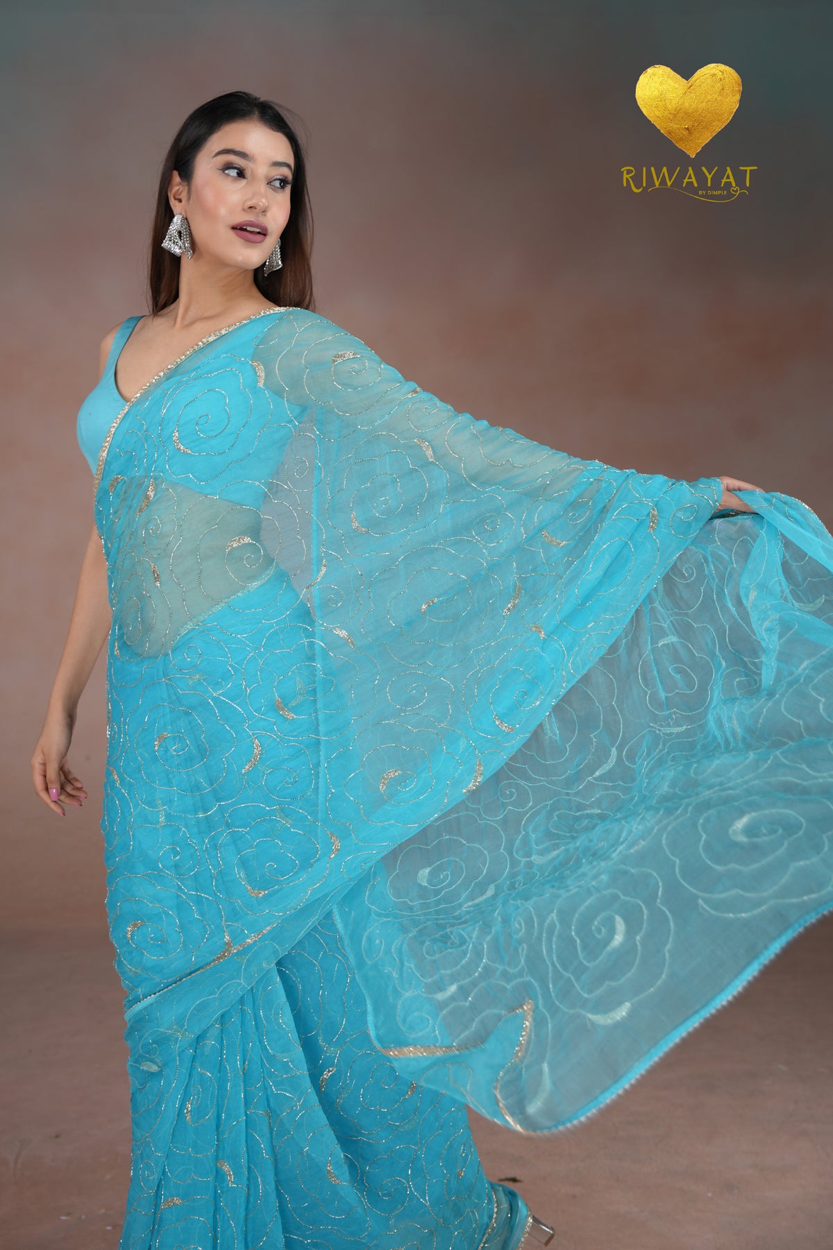 Turquoise Blue Organza Saree with Floral Swirl Embroidery