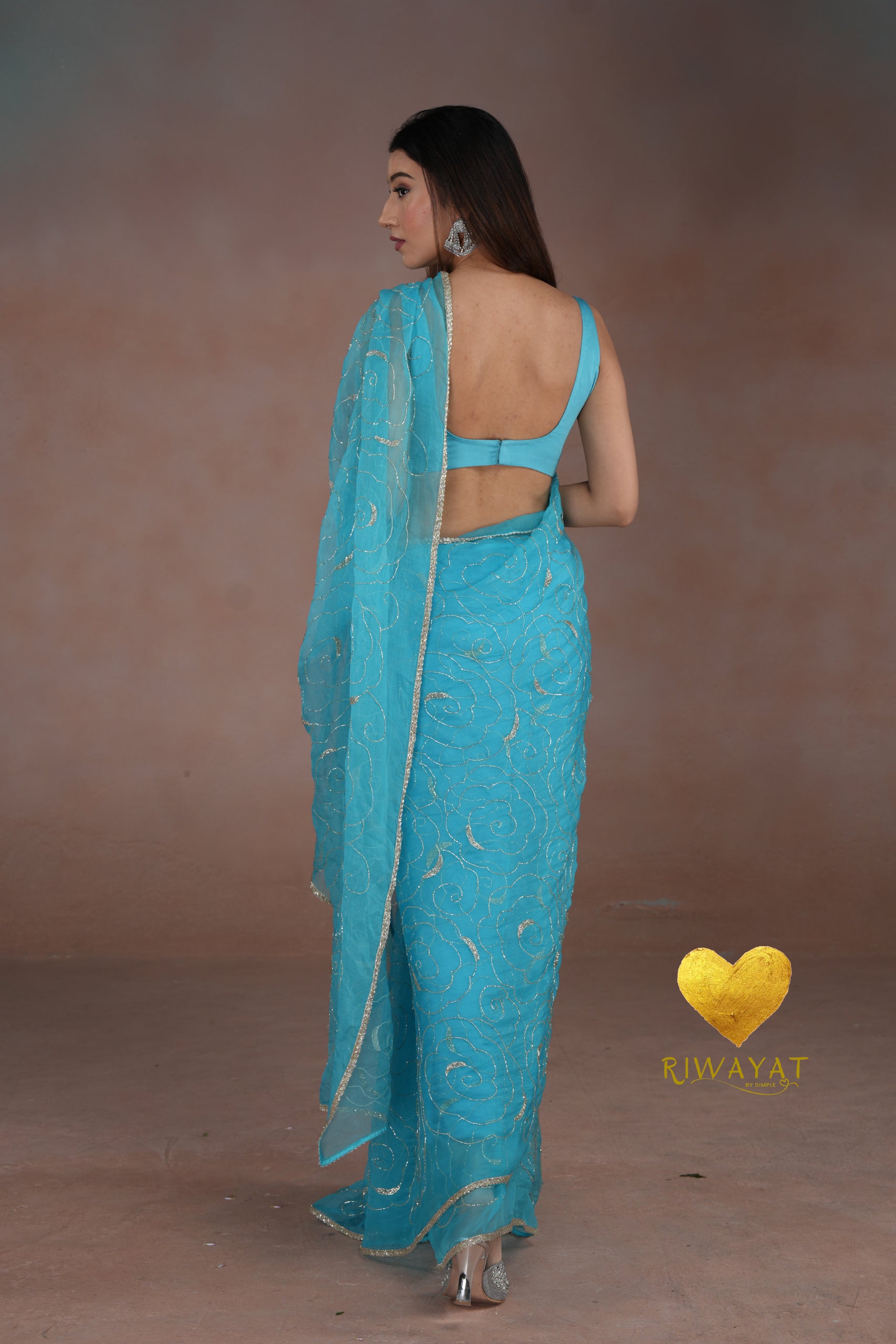 Turquoise Blue Organza Saree with Floral Swirl Embroidery