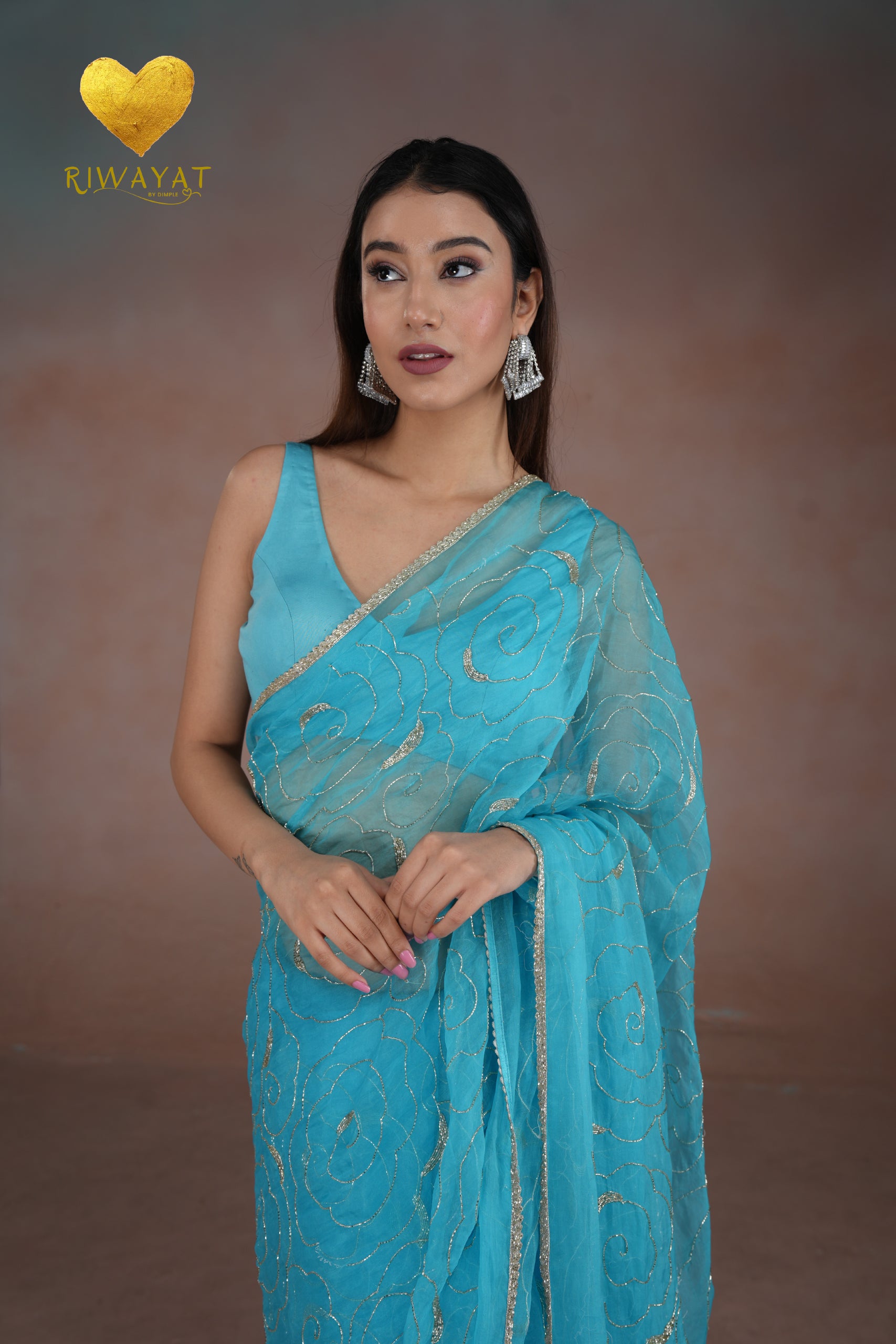 Turquoise Blue Organza Saree with Floral Swirl Embroidery